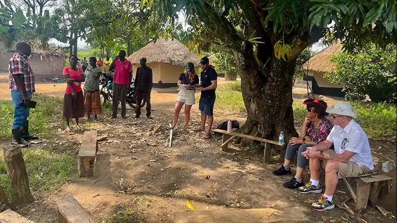 Visiting a partner farmer and his large family.